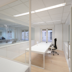 Modern office with white furniture.