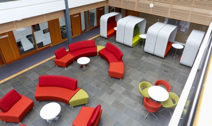 modern reception aerial with rend and apple green furniture