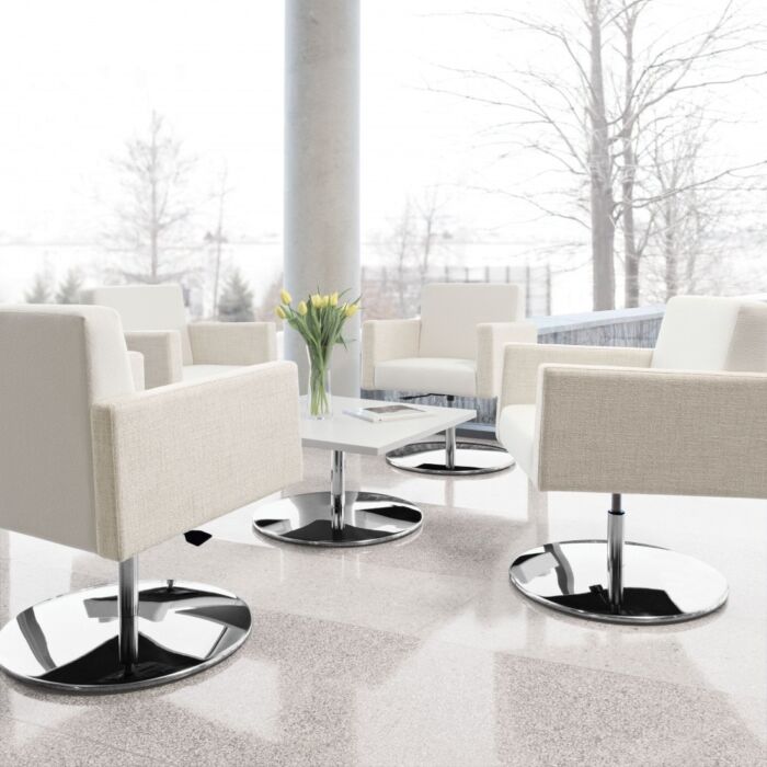 off white pedestal chairs in a lounge setting