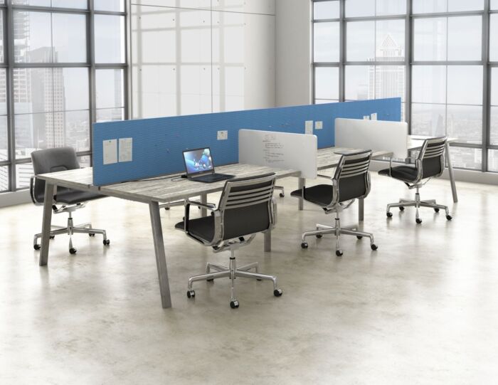 open office bench desking in window filled office