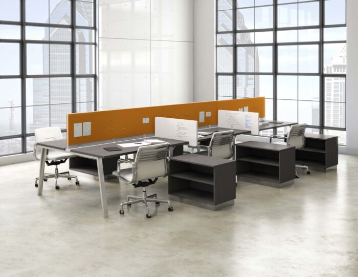 open office bench desking in window filled office