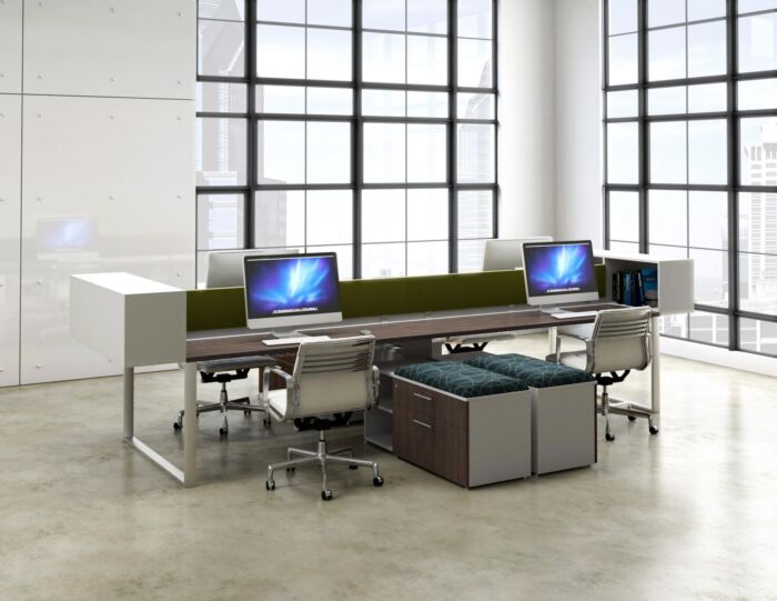 open office bench desking in window filled office