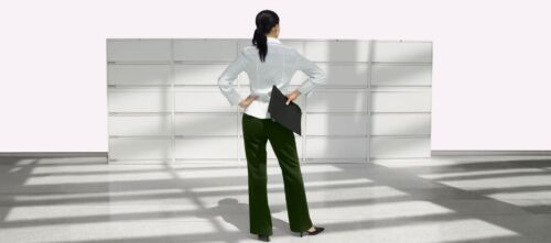 woman standing in front of Lateral Filing Systems with hand on hips