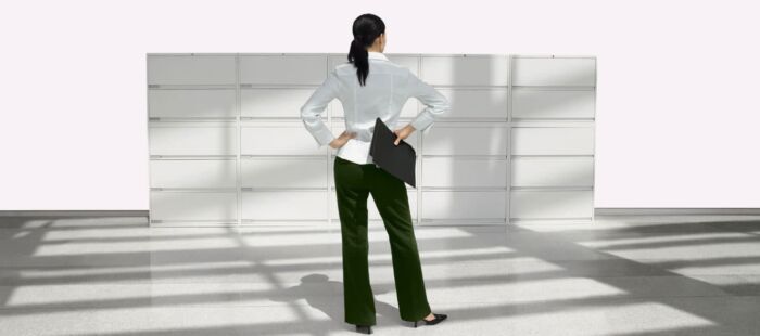 woman standing in front of Lateral Filing Systems with hand on hips