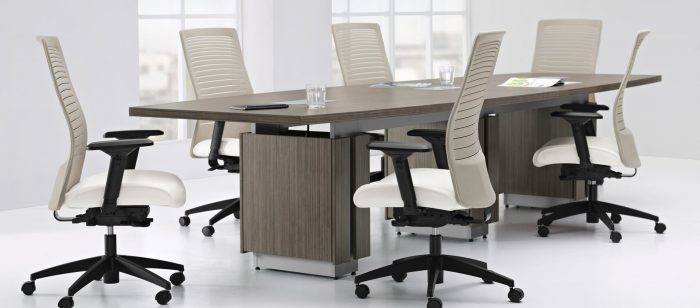 Zira Conference Boardroom Table With White Chairs In A Boardroom
