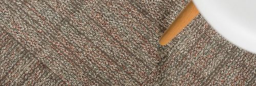 Studio shot close to a round table, taken from overhead. This furniture is resting on Impromptu carpeting.