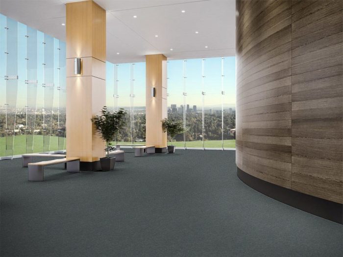 Passages 20 flooring in a large public area. Tall ceilings and full length windows look out to the valley and city nearby.