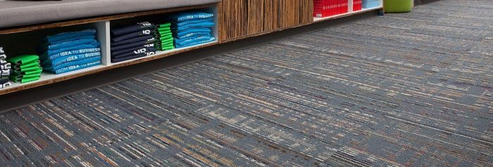 Studio shot behind a counter, with Relativity carpeting lining the length of the room.