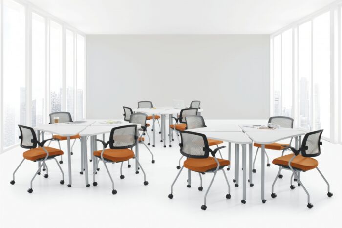 square training table set up with orange cushioned seating